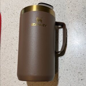 Stanley 24 oz Tan and Gold Travel Mug